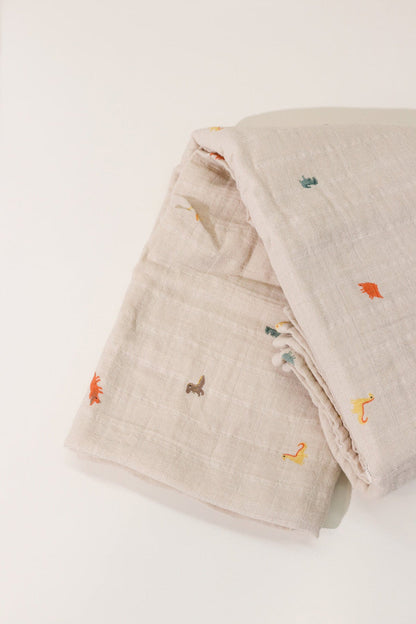 Mushie dinosaurs organic swaddle